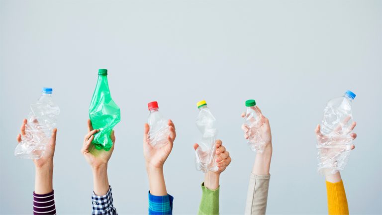 People holding plastic bottles