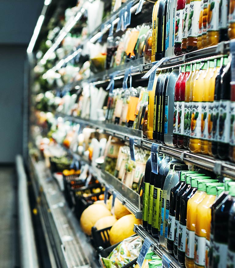 grocery store shelf filled with food and beverages