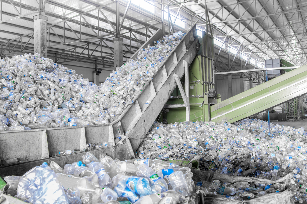 Plastic bottles in a factory for processing in recycling - typically the end of a closed loop recycling system 